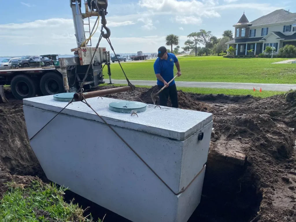 Crotty Services crew setting a septic tank in Brevard County