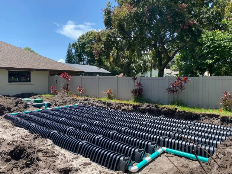 Drainfield chambers laid in a fenced backyard