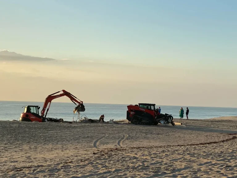 Excavator and loader working along the shoreline
