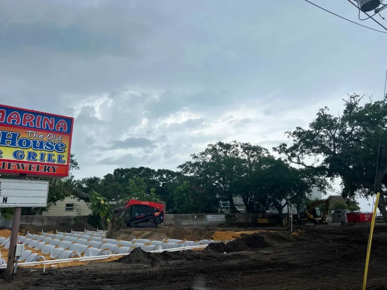Commercial septic job beside a restaurant sign