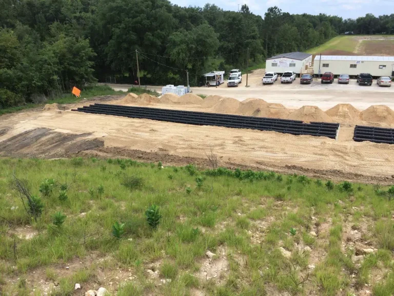 Commercial drainfield bed beside a mobile home park