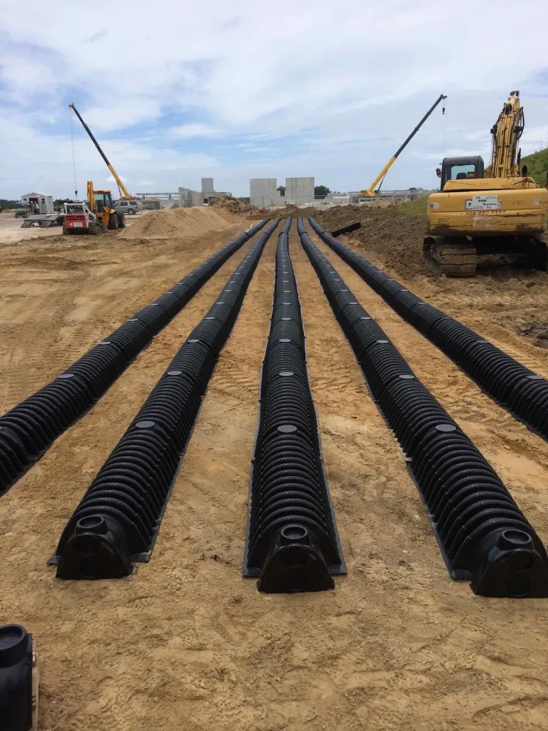 Rows of drainfield pipe on a commercial job