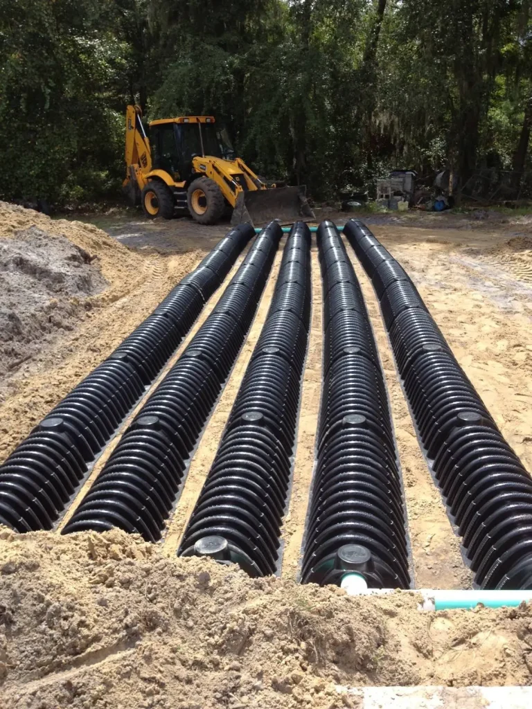 Rows of drainfield pipe laid in a trench